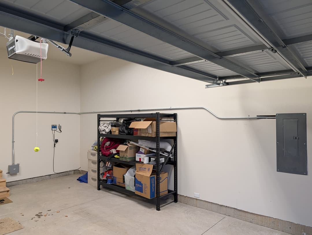 Clean conduit installation and electrical panel work completed by Stateline Electrical in a residential garage