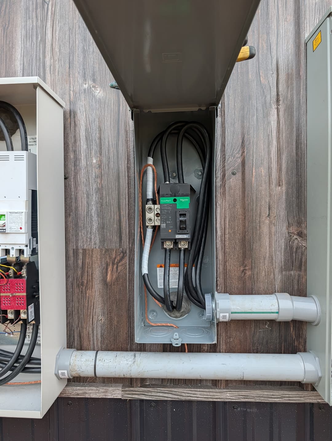Square D PowerPacT breaker disconnect installed on an exterior electrical panel for commercial service.
