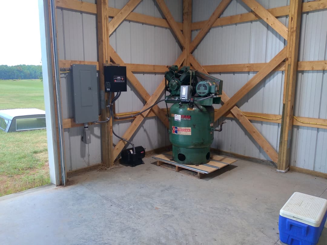 Electrical subpanel and American Rotary phase converter installed to power a shop air compressor in a pole building.